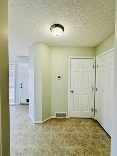 8 Royal Elm Way Nw, Calgary, AB - Indoor Photo Showing Other Room