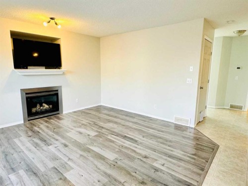 8 Royal Elm Way Nw, Calgary, AB - Indoor Photo Showing Living Room With Fireplace