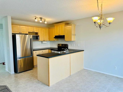 8 Royal Elm Way Nw, Calgary, AB - Indoor Photo Showing Kitchen With Double Sink