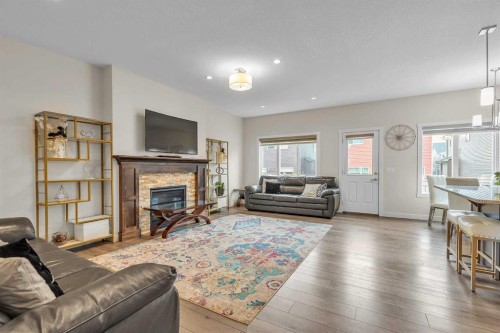 7672 80 Avenue Ne, Calgary, AB - Indoor Photo Showing Living Room With Fireplace
