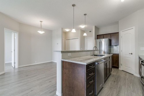 432-1 Crystal Green Lane, Okotoks, AB - Indoor Photo Showing Kitchen With Upgraded Kitchen