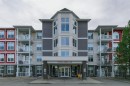 432-1 Crystal Green Lane, Okotoks, AB  - Outdoor With Balcony With Facade 