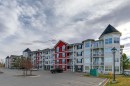 432-1 Crystal Green Lane, Okotoks, AB  - Outdoor With Balcony With Facade 