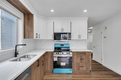 11 Hidden Valley Link Nw, Calgary, AB - Indoor Photo Showing Kitchen With Double Sink