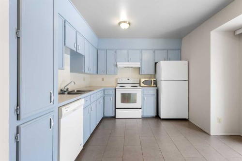 15 Edgedale Way Nw, Calgary, AB - Indoor Photo Showing Kitchen With Double Sink