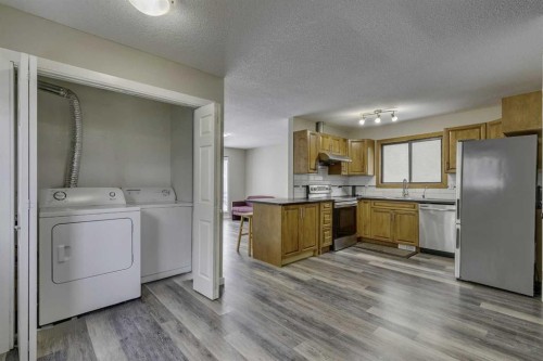 68 Woodglen Close Sw, Calgary, AB - Indoor Photo Showing Laundry Room