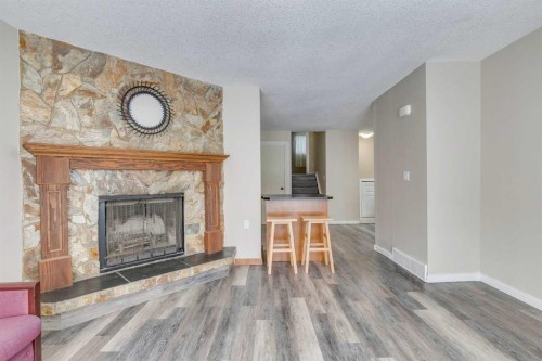 68 Woodglen Close Sw, Calgary, AB - Indoor Photo Showing Living Room With Fireplace