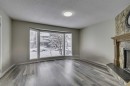 68 Woodglen Close Sw, Calgary, AB  - Indoor With Fireplace 