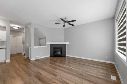 625 Midtown Place, Airdrie, AB - Indoor Photo Showing Other Room With Fireplace