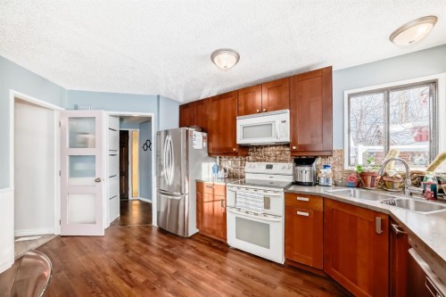 35 Macewan Drive Nw, Calgary, AB - Indoor Photo Showing Kitchen With Double Sink