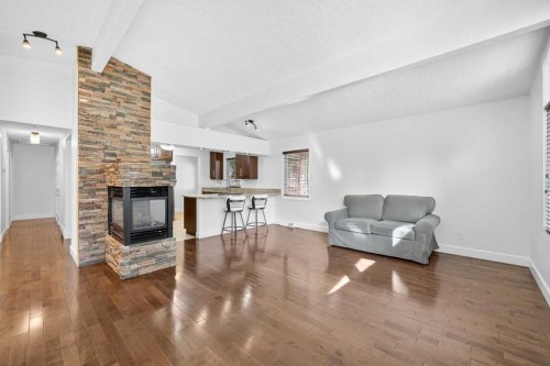 2831 Brecken Road Nw, Calgary, AB - Indoor Photo Showing Living Room With Fireplace