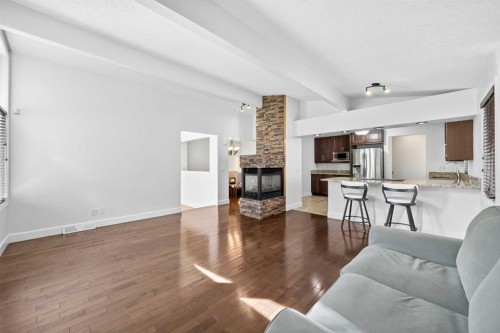 2831 Brecken Road Nw, Calgary, AB - Indoor Photo Showing Living Room With Fireplace