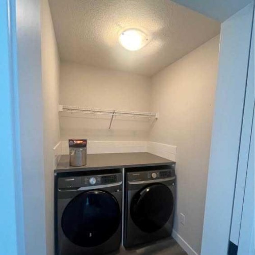 184 Emberside Place, Cochrane, AB - Indoor Photo Showing Laundry Room