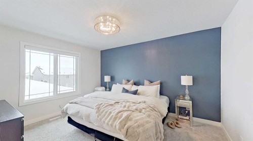 184 Emberside Place, Cochrane, AB - Indoor Photo Showing Bedroom