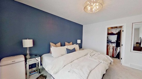 184 Emberside Place, Cochrane, AB - Indoor Photo Showing Bedroom