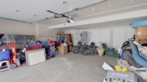 184 Emberside Place, Cochrane, AB - Indoor Photo Showing Garage