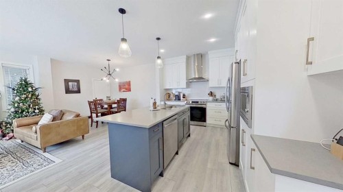 184 Emberside Place, Cochrane, AB - Indoor Photo Showing Kitchen With Double Sink With Upgraded Kitchen