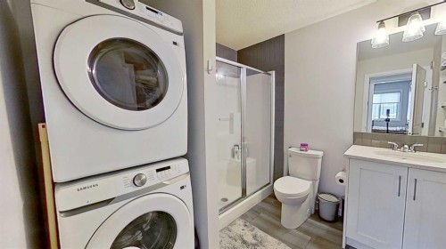 184 Emberside Place, Cochrane, AB - Indoor Photo Showing Laundry Room
