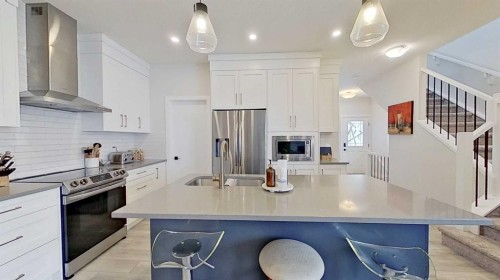 184 Emberside Place, Cochrane, AB - Indoor Photo Showing Kitchen With Upgraded Kitchen