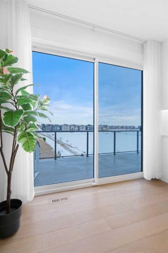 21 Sunvalley View, Cochrane, AB - Indoor Photo Showing Other Room With Body Of Water