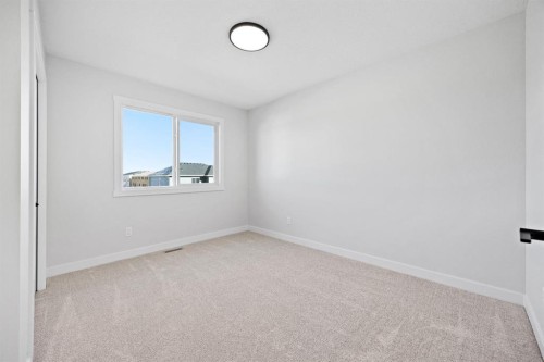 56 Fireside Common, Cochrane, AB - Indoor Photo Showing Other Room