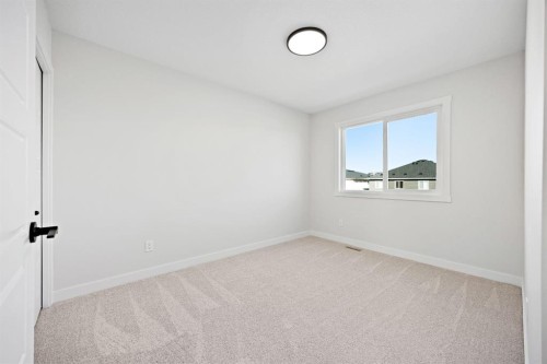 56 Fireside Common, Cochrane, AB - Indoor Photo Showing Other Room