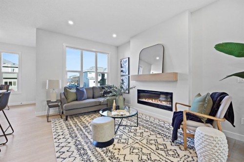 56 Fireside Common, Cochrane, AB - Indoor Photo Showing Living Room With Fireplace