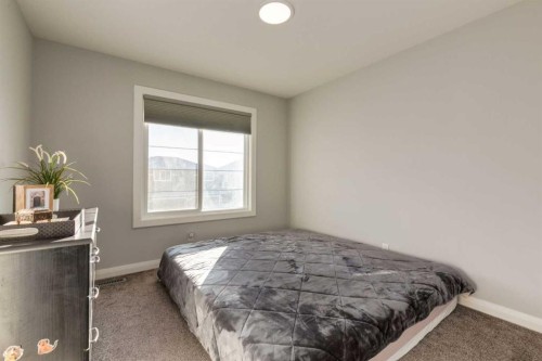 57 Evansfield Gate Nw, Calgary, AB - Indoor Photo Showing Bedroom