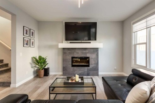 57 Evansfield Gate Nw, Calgary, AB - Indoor Photo Showing Living Room With Fireplace