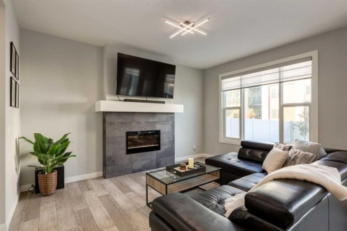 57 Evansfield Gate Nw, Calgary, AB - Indoor Photo Showing Living Room With Fireplace