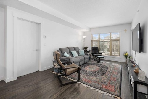 305-45 Aspenmont Heights Sw, Calgary, AB - Indoor Photo Showing Living Room