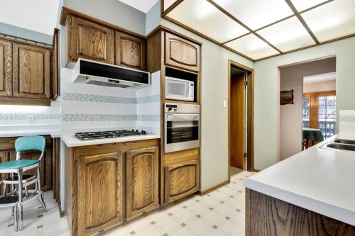 79 Chancellor Way Nw, Calgary, AB - Indoor Photo Showing Kitchen With Double Sink