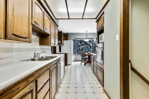79 Chancellor Way Nw, Calgary, AB - Indoor Photo Showing Kitchen With Double Sink