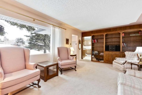 79 Chancellor Way Nw, Calgary, AB - Indoor Photo Showing Living Room