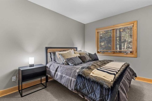3-124 Silvertip Ridge, Canmore, AB - Indoor Photo Showing Bedroom
