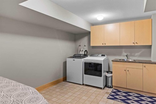 3-124 Silvertip Ridge, Canmore, AB - Indoor Photo Showing Laundry Room