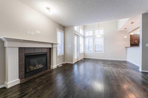 20 Bridlecrest Court Sw, Calgary, AB - Indoor Photo Showing Living Room With Fireplace