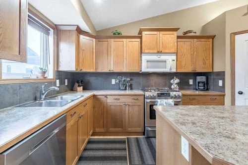 518 Sunrise Way Sw, Diamond Valley, AB - Indoor Photo Showing Kitchen With Double Sink