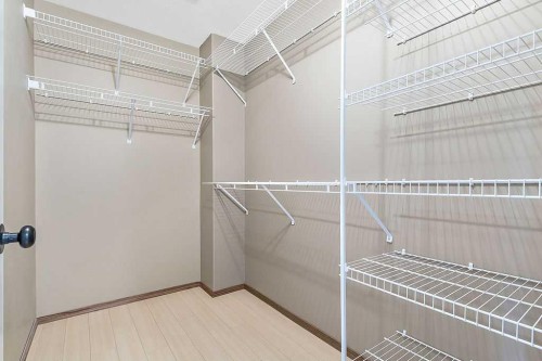 518 Sunrise Way Sw, Diamond Valley, AB - Indoor With Storage