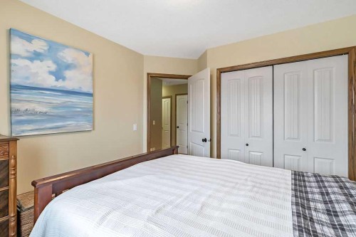 518 Sunrise Way Sw, Diamond Valley, AB - Indoor Photo Showing Bedroom