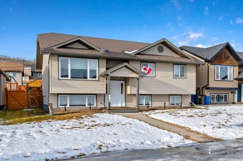 518 Sunrise Way Sw, Diamond Valley, AB - Outdoor With Facade
