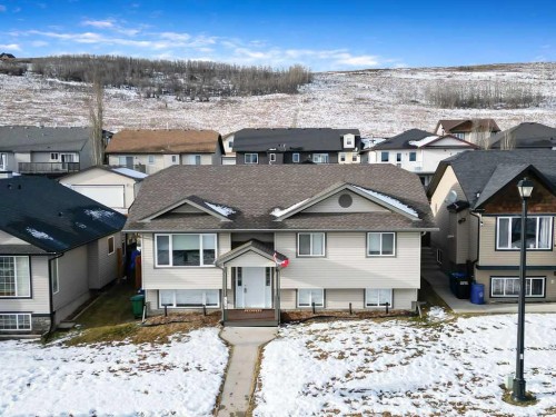 518 Sunrise Way Sw, Diamond Valley, AB - Outdoor With Facade