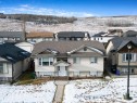 518 Sunrise Way Sw, Diamond Valley, AB  - Outdoor With Facade 