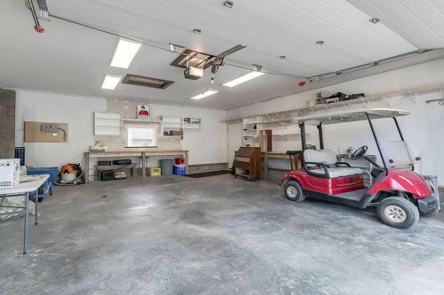 518 Sunrise Way Sw, Diamond Valley, AB - Indoor Photo Showing Garage