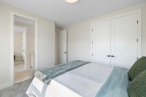 48 Sunvalley View, Cochrane, AB - Indoor Photo Showing Bedroom