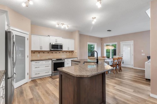 405 Kincora Drive Nw, Calgary, AB - Indoor Photo Showing Kitchen With Stainless Steel Kitchen With Double Sink With Upgraded Kitchen