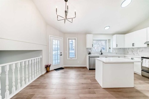 624 Shawinigan Drive Sw, Calgary, AB - Indoor Photo Showing Kitchen With Double Sink