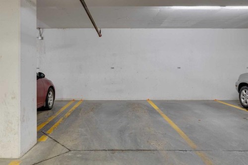 103-25 Aspenmont Heights Sw, Calgary, AB - Indoor Photo Showing Garage