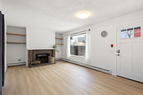 1601 15 Street Sw, Calgary, AB - Indoor Photo Showing Living Room With Fireplace