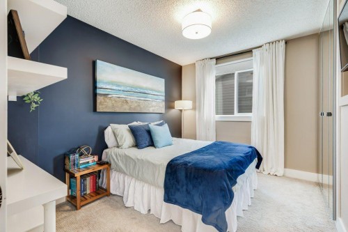 1220 Meadowbrook Drive Se, Airdrie, AB - Indoor Photo Showing Bedroom